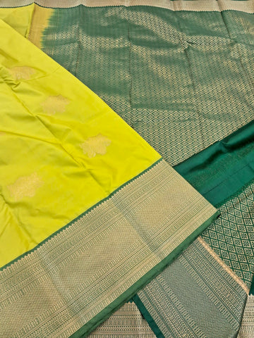 KSS338 Kanjivaram Semi Silk Saree In Yellow w/ Dark Green Border. Fall Peco done. Comes w/ stitched blouse size: 38 to 46.