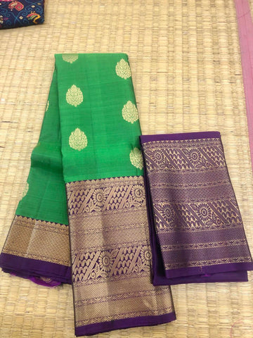KSS311 Pure Kanjivaram Silk Saree In Green w/ Wide Zari Border. Fall Peco done. Stitched blouse size: 38 to 46. SILK MARK CERTIFIED