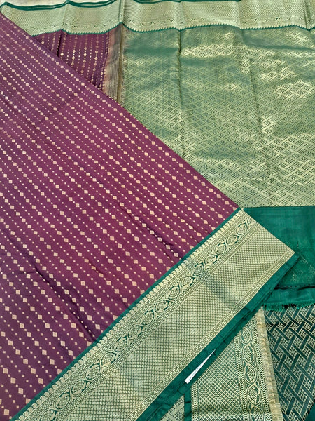 KSS344 Kanjivaram Semi Silk Saree In Maroon w/ Bottle Green Border. Fall Peco done. Comes w/ stitched blouse size: 38 to 46.