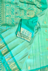 PURE GADWAL HANDLOOM SILK SAREE IN PASTEL GREEN WITH TEAL ZARI BORDER AND PALLU