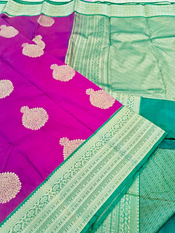 KSS347 Kanjivaram Semi Silk Saree In Magenta w/ Bottle Green Border. Fall Peco done. Comes w/ stitched blouse size: 38 to 46.