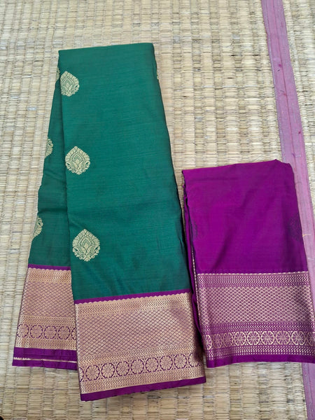 KSS340 Kanjivaram Semi Silk Saree In Dark Green w/ Magenta Border. Fall Peco done. Comes w/ stitched blouse size: 38 to 46.