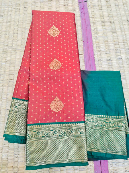 KSS348 Kanjivaram Semi Silk Saree In Rust Orange w/ Bottle Green Border. Fall Peco done. Comes w/ stitched blouse size: 38 to 46.