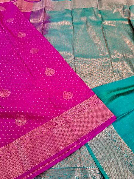 KSS345 Kanjivaram Semi Silk Saree In Rani Pink w/ Gold Border. Fall Peco done. Comes w/ stitched blouse size: 38 to 46.