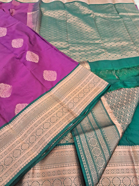 KSS343 Kanjivaram Semi Silk Saree In Green w/ Magenta Border. Fall Peco done. Comes w/ stitched blouse size: 38 to 46.