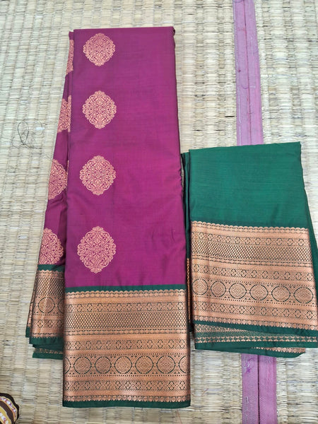 KSS343 Kanjivaram Semi Silk Saree In Green w/ Magenta Border. Fall Peco done. Comes w/ stitched blouse size: 38 to 46.