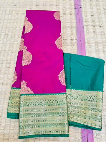 KSS347 Kanjivaram Semi Silk Saree In Magenta w/ Bottle Green Border. Fall Peco done. Comes w/ stitched blouse size: 38 to 46.