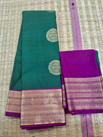 KSS341 Kanjivaram Semi Silk Saree In Dark Green w/ Magenta Border. Fall Peco done. Comes w/ stitched blouse size: 38 to 46.
