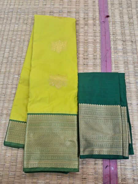 KSS337 Kanjivaram Semi Silk Saree In Light Green w/ Dark Green Border. Fall Peco done. Comes w/ stitched blouse size: 38 to 46.