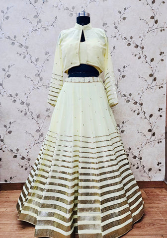 AFL1055-Chiffon Lehenga in lemon yellow comes with vertical stripes gold Zari work on the border and  with Net Dupatta. Also Comes with a matching stitched corset blouse and jacket.