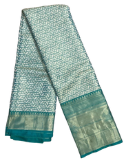 HPSS609 - Banarasi Soft Silk Saree in Silver with Sea Green Border. Comes with stitched blouse (size 38, can go up to size 42). Fall Peco Done.