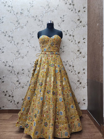 AFL1039-Georgette Lehenga in yellow comes with heavy embroidery and sequins work and with Net Dupatta. Also Comes with a matching stitched blouse.