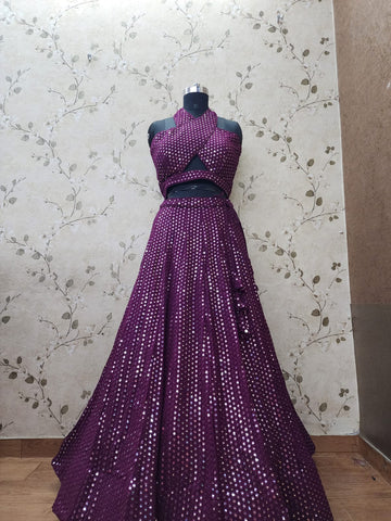 AFL1034 -Georgette Lehenga in dark purple with foil mirror work and with Net Dupatta. Also Comes with a matching stitched blouse.