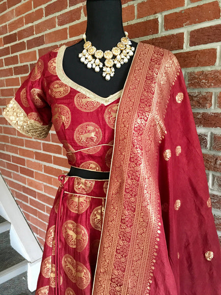 AFL1013 - Banarasi Silk Lehenga in Maroon comes with gold zari  work. Comes with banarasi silk dupatta. Comes with stitiched blouse