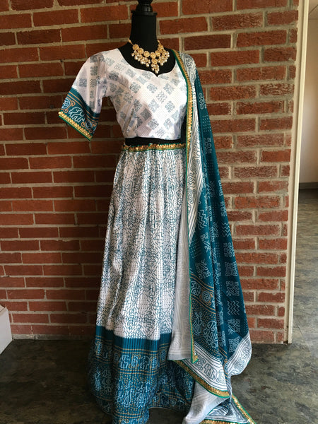 AFL1017 - Raw silk lehenga with digital bandhej prints. Dupatta embellished with bandhej print and lace work . Come with stitched blouse.